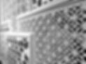 Carved wooden lattice work with modern style pattern art. Perforated wooden design in Mono